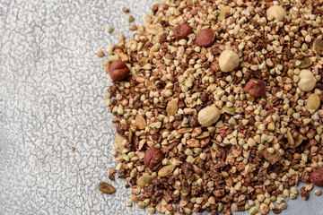 Healthy breakfast, vegan vegetarian granola made of green buckwheat with nuts and pumpkin seeds