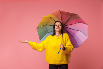 Cheerful young woman wearing sweater