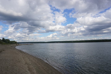 River Ob city of Novosibirsk, coast, sand and clouds