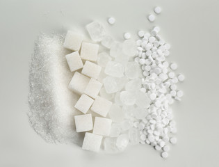 Different kinds of sugar on white background