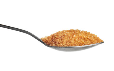 Spoon with brown sugar on white background
