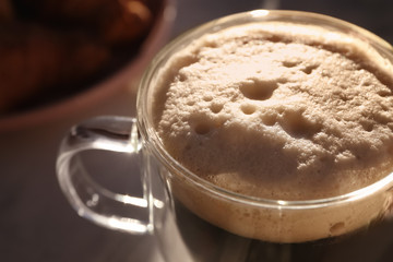 Glass cup of tasty aromatic coffee, closeup