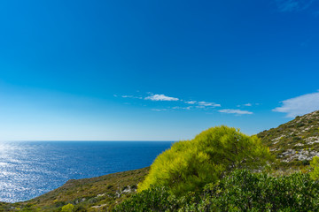 Fototapeta premium Greece, Zakynthos, Blue sky and blue ocean in contrast to green nature landscape