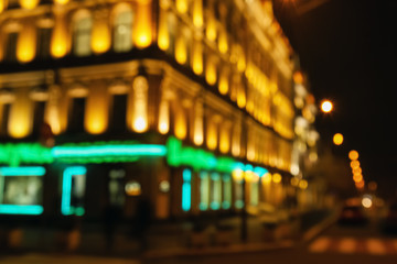 Blurred view of illuminated building in city at night