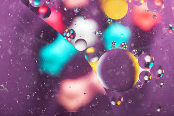 abstract background texture of colored oil droplets in the water