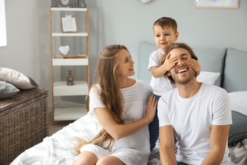 Happy family playing at home