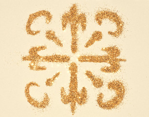 Snowflake of golden glitter sparkles in vintage colors