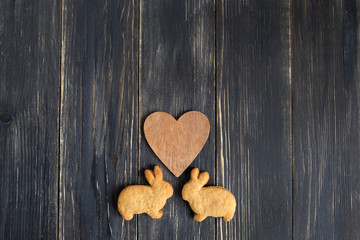 Obraz premium Easter still life. cookies bunnies and heart. Dark tone, soft focus, background mode
