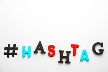Hashtag composed of letters on white background