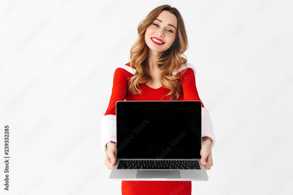 Poster pretty excited woman in christmas costume showing display of laptop computer.