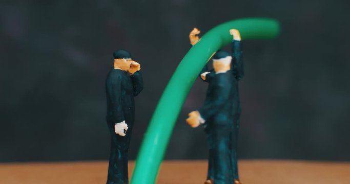 Miniature Figurines Of working. macro. 4K.
