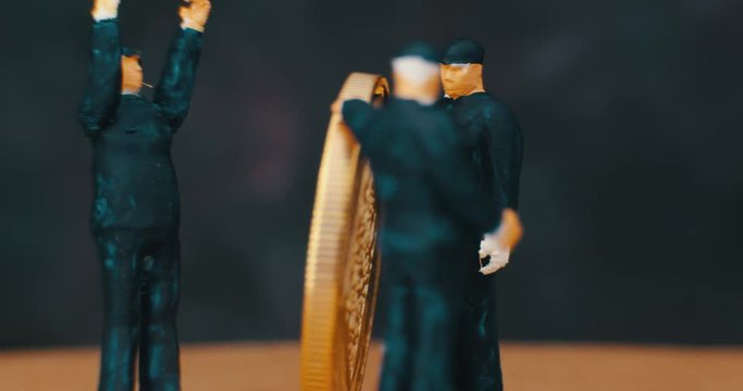 Miniature Figurines Of working. Bit coin. macro. 4K.
