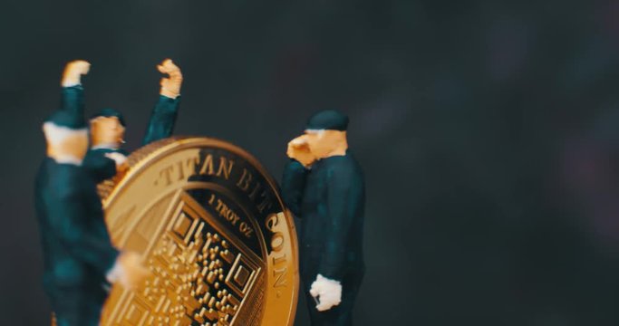 Miniature Figurines Of working. Bit coin. macro. 4K.

