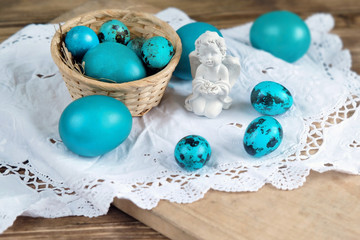 Easter eggs and little angel. Easter Holiday background. Spring season, festive scene. 