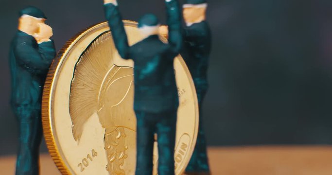 Miniature Figurines Of working. Bit coin. macro. 4K.
