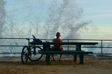 man sitting on a bench in park