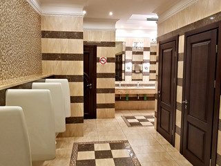 Restroom interior in beige tones in a modern hotel