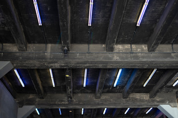 neon lights in ceiling above trainline