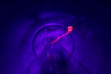 Rotating walls with moving lights abstract with red light