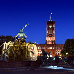 The Neptune Fountain ( Neptunbrunnen) and red city hall (Rotes Rathaus) at night, Alexander square...