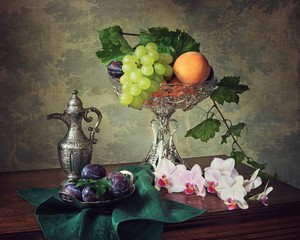 Still life with orchid branch and fruits © Iryna