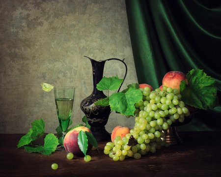 Still life with fruit and white wine