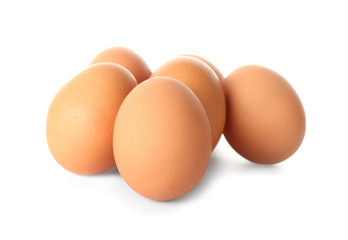 Raw chicken eggs on white background