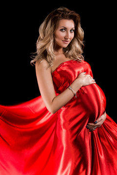 Pregnant woman in a red silk