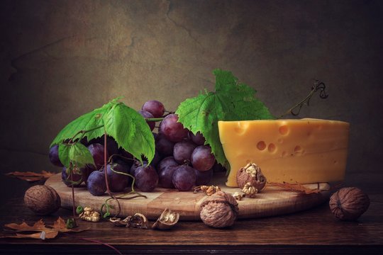 Still life with grapes and cheese