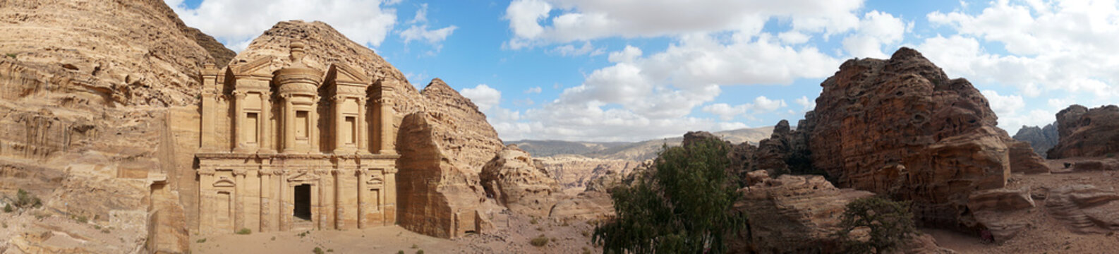 Ad-Deir-Nabataean rock temple of the I century ad, preserved near the city of Peter. a monumental building carved entirely from the rock. Lost city in the mountains. Panoramic view of Petra