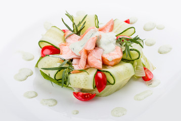 Salad with smoked salmon and cucumber. On white background.