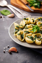 Conchiglioni pasta with spinach in creamy sauce 