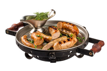Set of homemade sausages in a pan. On white background.