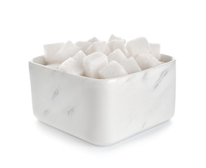 Bowl with sugar cubes on white background