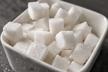Bowl with sugar cubes, closeup