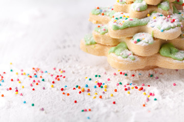 Pine tree Christmas cookies with festive decoration with copy space