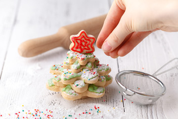 Homemade Gingerbread cookies Christmas Trees, decorated with icing and sugar decorations