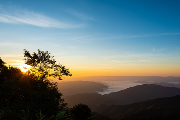 Foggy on the mountain at sunset.
