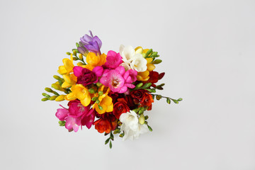 Bouquet of colorful flowers on white background for spring and summer holidays and post card. Top view.