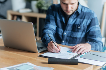 Modern Businessman Writing at His Office