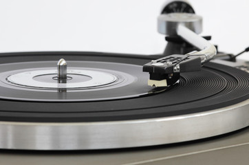 Vintage record player with vinyl record. Front view.