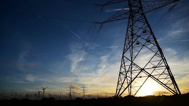 Electricity pylon in the countryside at sunset. Sardinia, Italy