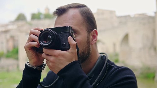 Photographer taking photos using mirrorless camera