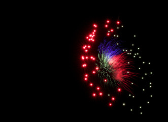 Multicolorful fireworks in black background with space for text in the left,artistic fireworks in Malta,Malta fireworks festival in dark background,colorful fireworks, explosion close up,4 July
