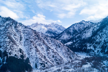 Winter landscape. Highlands. Almaty, Kazakhstan. Gondola road to the mountain resort.