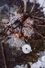 Coffee cooking on campfire. Concept adventure active vacations outdoor. Winter camping