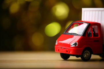 toy car wooden table gold bokeh