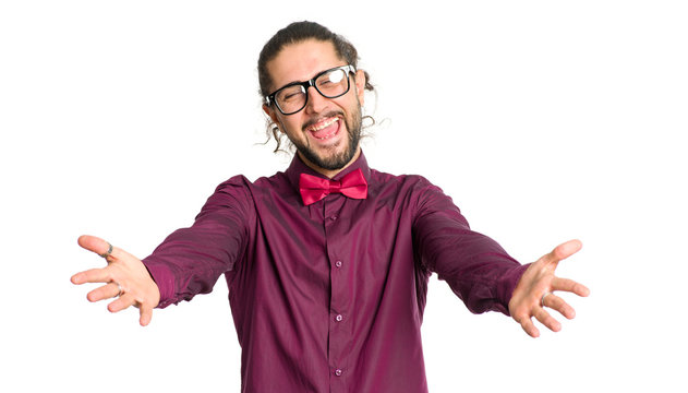 Portrait of a cheerful friendly man with glasses stretched out his hands in front of isolated on white background.