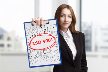 Business, technology, internet and networking concept. Young entrepreneur showing keyword: ISO 9001