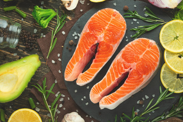 Fresh pieces of steak salmon, trout, salmon, pink salmon. With ingredients. Healthy and clean food. Diet and veganism, background for design, market, products, restaurant and home cooking, recipes